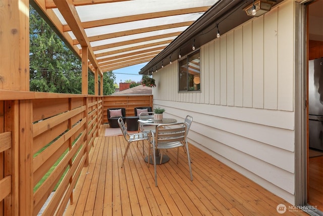 wooden deck with outdoor dining area