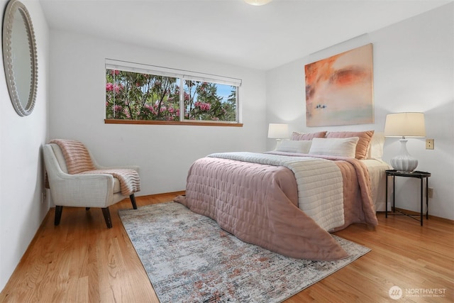 bedroom featuring wood finished floors