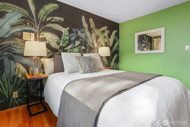 bedroom featuring wood finished floors