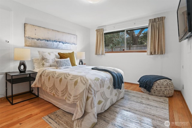 bedroom with wood finished floors