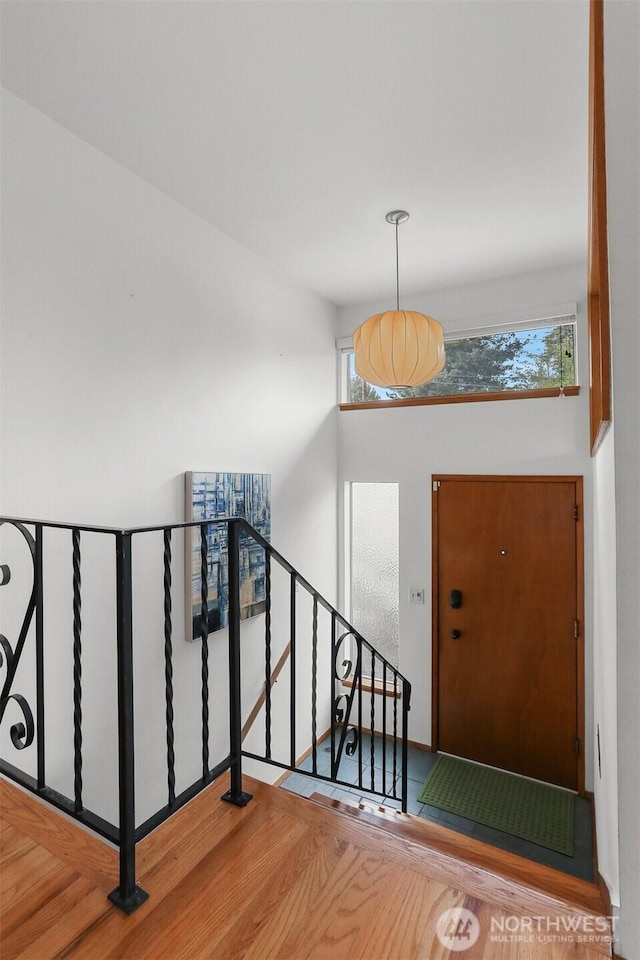 entryway with wood finished floors