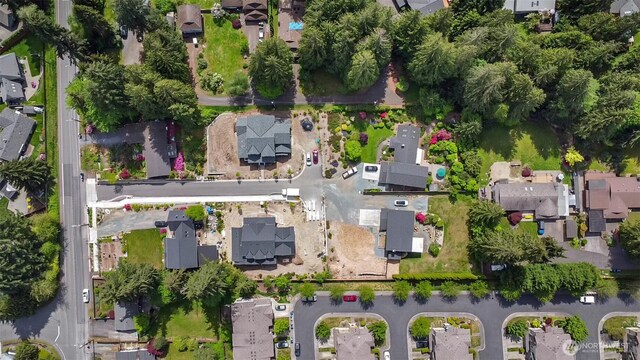 aerial view of property and surrounding area featuring nearby suburban area and property parcel outlined