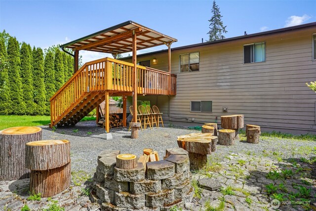 view of jungle gym featuring a wooden deck and stairway