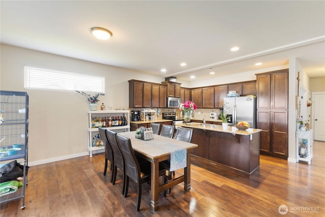 14464 99th Way SE, Yelm, WA 98597 - dining space featuring dark wood-style flooring, recessed lighting, and baseboards