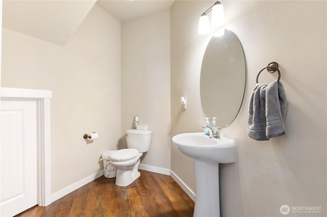 14464 99th Way SE, Yelm, WA 98597 - half bathroom featuring wood finished floors, toilet, baseboards, and a sink