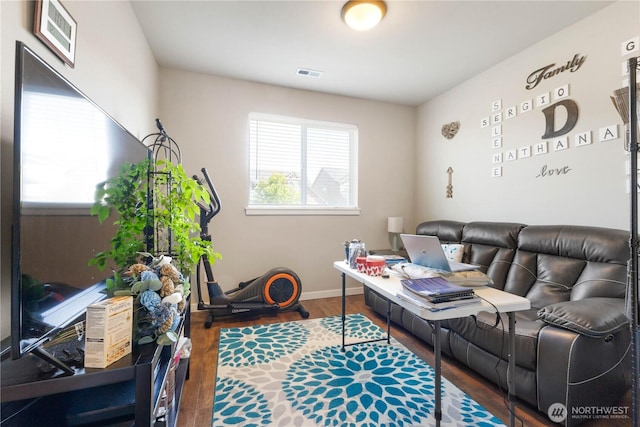 14464 99th Way SE, Yelm, WA 98597 - living area with wood finished floors, baseboards, and a desk