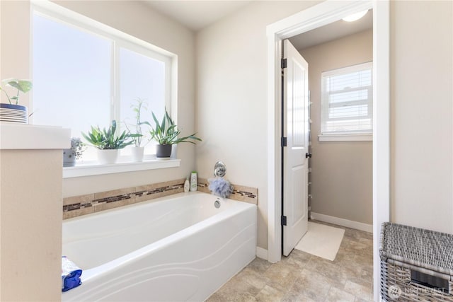 14464 99th Way SE, Yelm, WA 98597 - full bathroom featuring a garden tub and baseboards