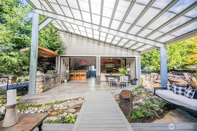 6130 Maltby Rd, Woodinville, WA 98072 - wooden terrace featuring an outdoor kitchen, area for grilling, and a pergola