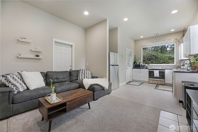 6130 Maltby Rd, Woodinville, WA 98072 - living area featuring light tile patterned floors, recessed lighting, and light colored carpet
