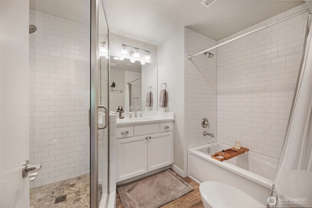 6130 Maltby Rd, Woodinville, WA 98072 - full bathroom with  shower combination, vanity, wood finished floors, and toilet