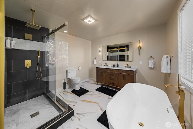 9919 Arrowsmith Ave S, Seattle, WA 98118 - bathroom featuring a shower stall, double vanity, a soaking tub, marble finish flooring, and baseboards