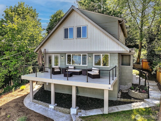 9919 Arrowsmith Ave S, Seattle, WA 98118 - back of property with an outdoor living space and a deck