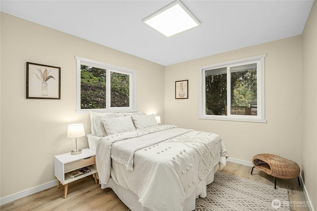 9919 Arrowsmith Ave S, Seattle, WA 98118 - bedroom with baseboards and light wood-style flooring