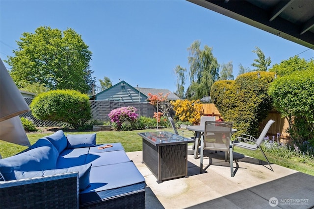 3342 Greenwood Ave W, University Place, WA 98466 - fenced backyard with outdoor lounge area, a patio area, and outdoor dining area