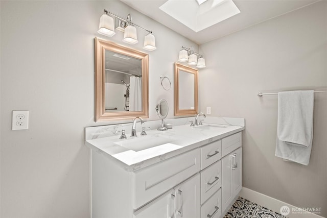 3342 Greenwood Ave W, University Place, WA 98466 - bathroom with a skylight, double vanity, and baseboards