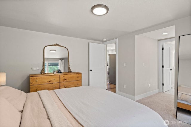 3342 Greenwood Ave W, University Place, WA 98466 - carpeted bedroom with freestanding refrigerator and baseboards