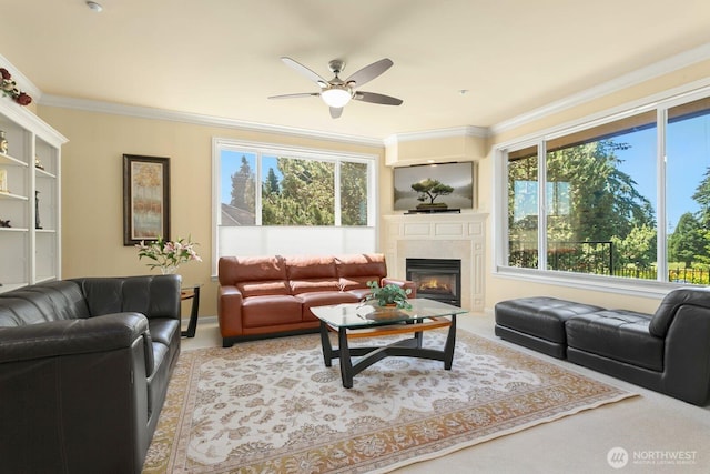 2440 S Steele St Unit 101, Tacoma, WA 98405 - living room with crown molding, ceiling fan, a fireplace with flush hearth, and light colored carpet