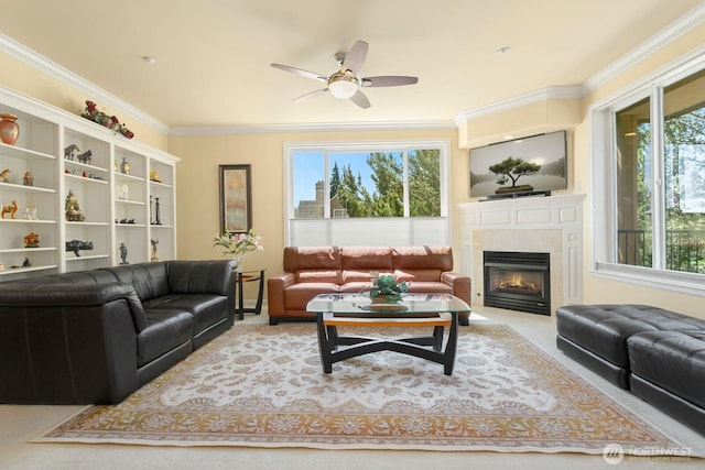 2440 S Steele St Unit 101, Tacoma, WA 98405 - living area featuring ornamental molding, a glass covered fireplace, a ceiling fan, and carpet flooring