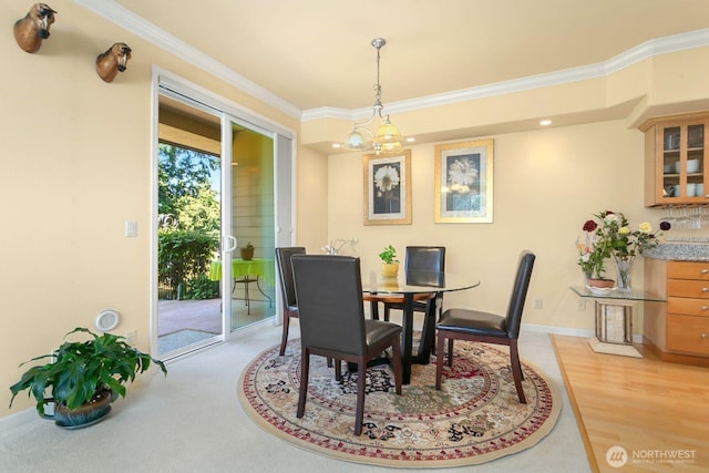 2440 S Steele St Unit 101, Tacoma, WA 98405 - dining space with crown molding, baseboards, and light wood finished floors
