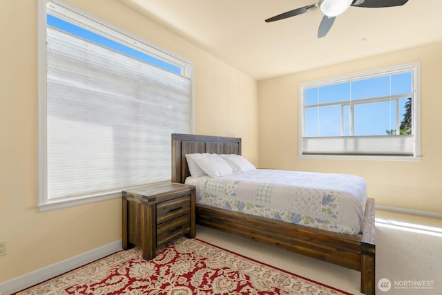 2440 S Steele St Unit 101, Tacoma, WA 98405 - bedroom featuring multiple windows, baseboards, and ceiling fan