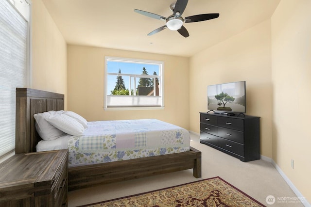 2440 S Steele St Unit 101, Tacoma, WA 98405 - carpeted bedroom with baseboards and ceiling fan