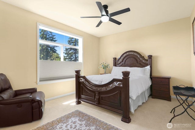 2440 S Steele St Unit 101, Tacoma, WA 98405 - bedroom with baseboards, light carpet, and ceiling fan