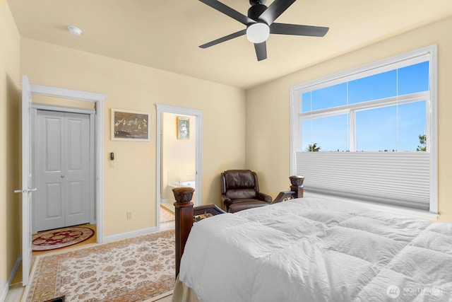 2440 S Steele St Unit 101, Tacoma, WA 98405 - bedroom featuring baseboards and ceiling fan