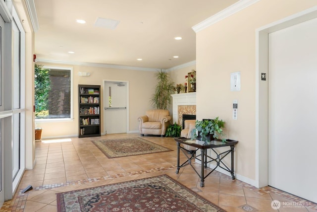 2440 S Steele St Unit 101, Tacoma, WA 98405 - tiled entrance foyer featuring ornamental molding, a tiled fireplace, baseboards, elevator, and recessed lighting