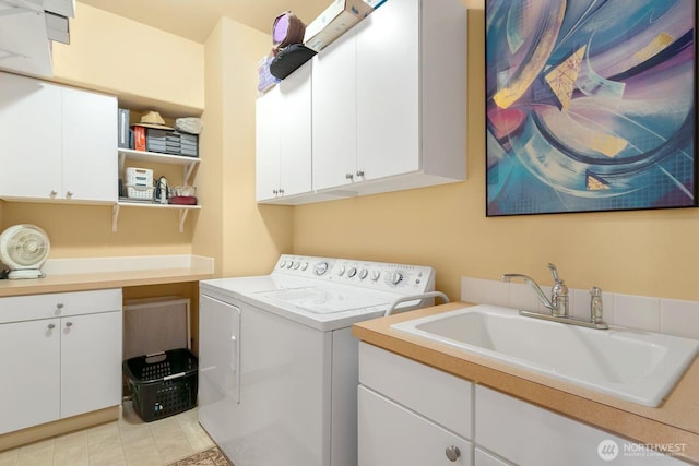 2440 S Steele St Unit 101, Tacoma, WA 98405 - laundry area featuring cabinet space, independent washer and dryer, and light tile patterned floors