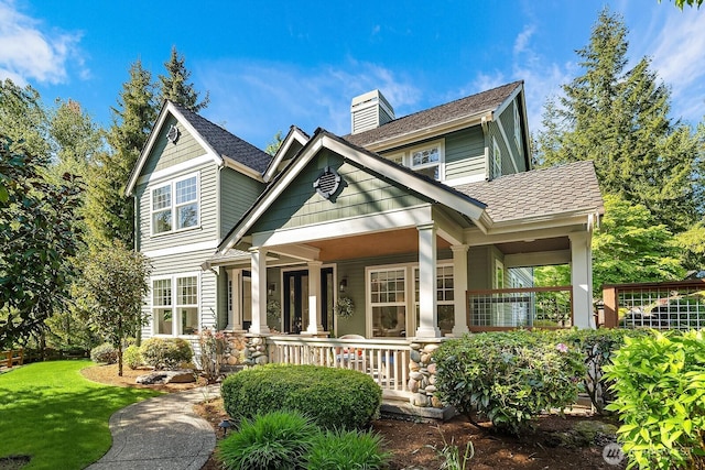 26108 SE 27th St, Sammamish, WA 98075 - view of front of property featuring covered porch, a chimney, and a front yard