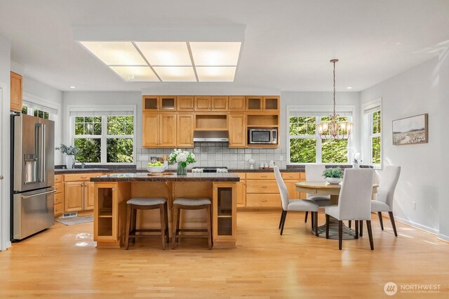 26108 SE 27th St, Sammamish, WA 98075 - kitchen featuring appliances with stainless steel finishes, open shelves, ventilation hood, a kitchen island, and dark countertops