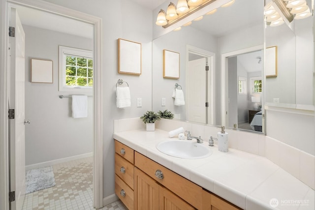 26108 SE 27th St, Sammamish, WA 98075 - ensuite bathroom featuring vanity and baseboards