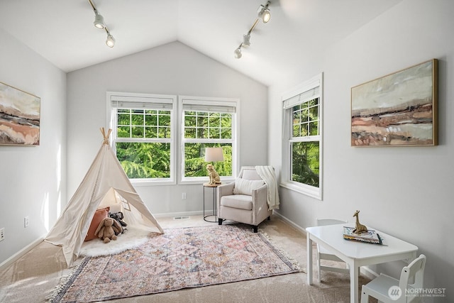 26108 SE 27th St, Sammamish, WA 98075 - living area featuring track lighting, carpet floors, healthy amount of natural light, lofted ceiling, and baseboards