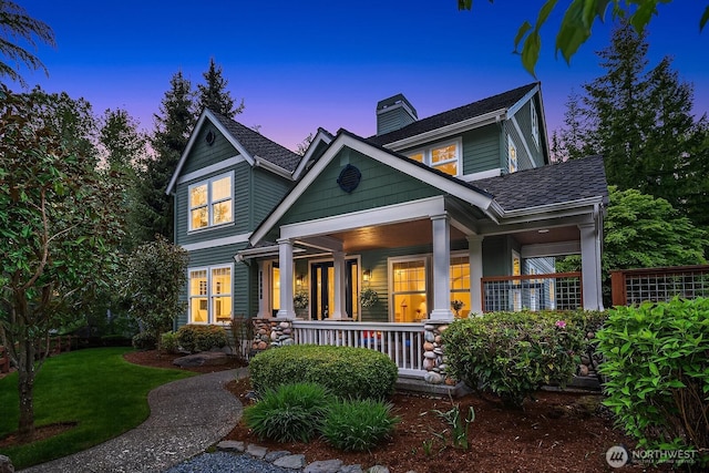 26108 SE 27th St, Sammamish, WA 98075 - rear view of property with covered porch, a chimney, a yard, and roof with shingles