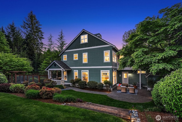 26108 SE 27th St, Sammamish, WA 98075 - view of front facade featuring a front lawn, an outdoor living space, a porch, and a chimney