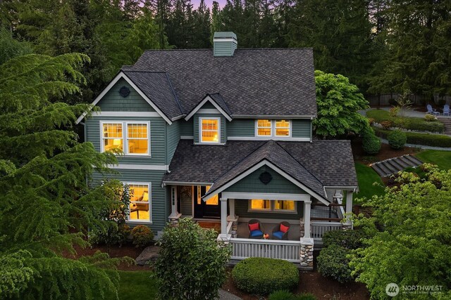 26108 SE 27th St, Sammamish, WA 98075 - view of front facade with roof with shingles, a porch, and a chimney