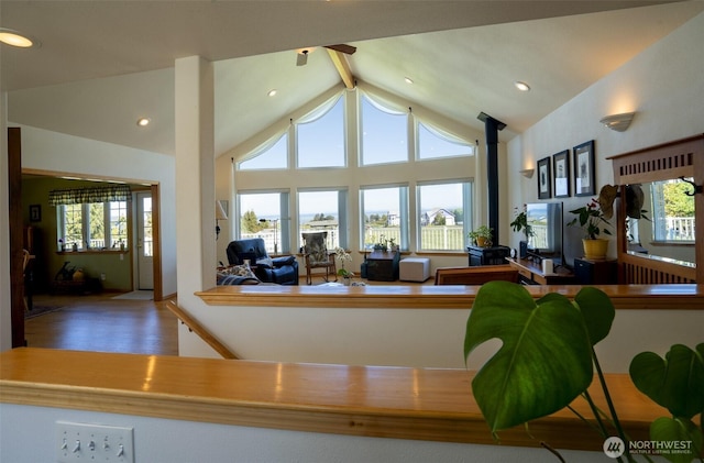 162 W Nelson Rd, Sequim, WA 98382 - living area with a wood stove, high vaulted ceiling, wood finished floors, recessed lighting, and beamed ceiling