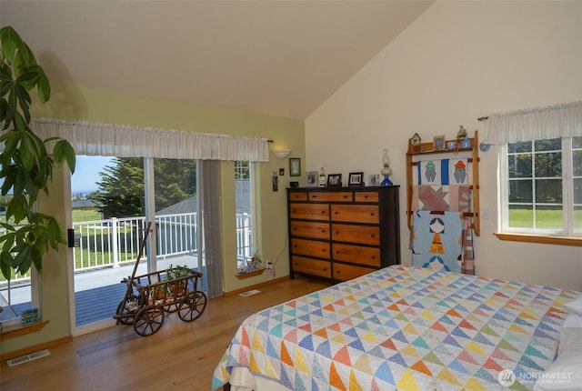 162 W Nelson Rd, Sequim, WA 98382 - bedroom with access to outside, vaulted ceiling, and wood finished floors