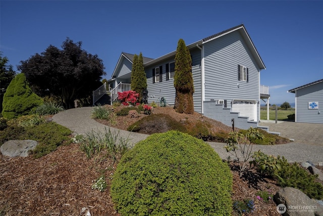 162 W Nelson Rd, Sequim, WA 98382 - view of property exterior with a garage, stairway, and driveway