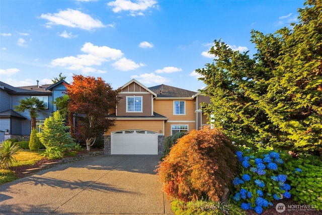 13106 SE 261st Pl, Kent, WA 98030 - view of front of house with driveway, an attached garage, and stone siding
