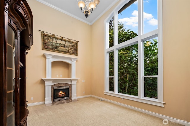 13106 SE 261st Pl, Kent, WA 98030 - unfurnished living room with carpet flooring, a chandelier, a tiled fireplace, ornamental molding, and a high ceiling