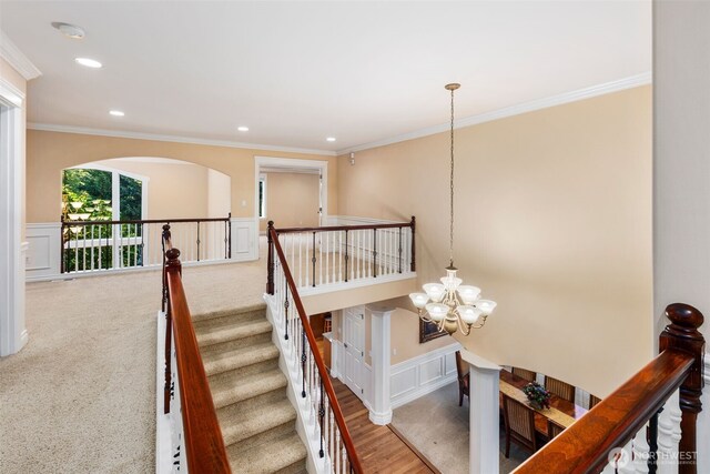 13106 SE 261st Pl, Kent, WA 98030 - stairway featuring a chandelier, a decorative wall, ornamental molding, wainscoting, and recessed lighting