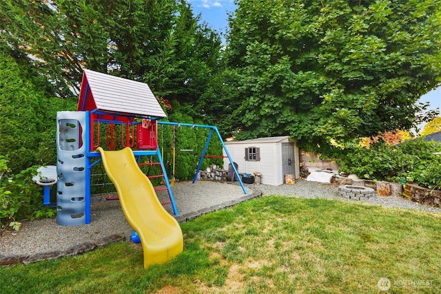 13106 SE 261st Pl, Kent, WA 98030 - view of jungle gym with an outdoor fire pit, a shed, and a lawn