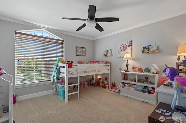 bedroom featuring crown molding, carpet flooring, a ceiling fan, and baseboards