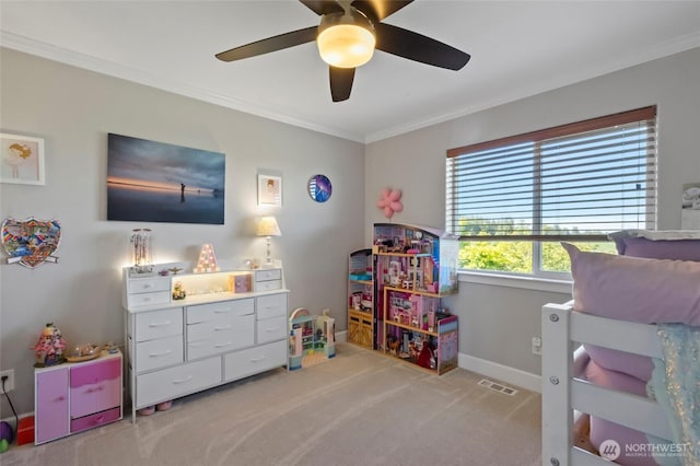 game room with carpet, a ceiling fan, ornamental molding, and baseboards