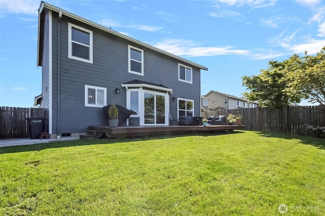 back of house featuring a deck