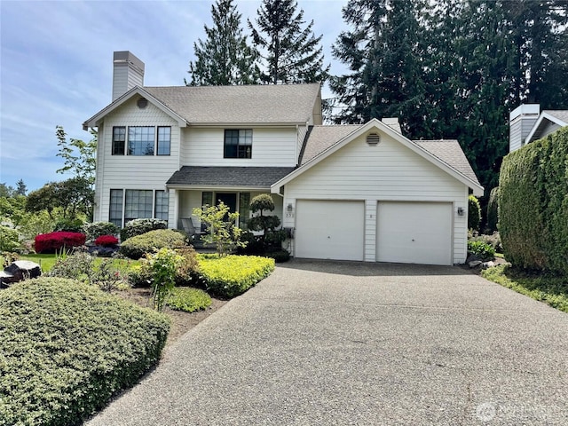 332 162nd Pl SE, Bothell, WA 98012 - traditional home featuring an attached garage, a chimney, driveway, and a shingled roof