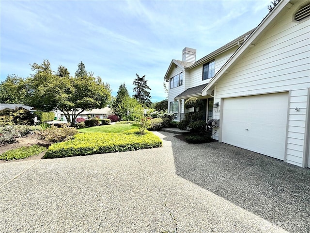 332 162nd Pl SE, Bothell, WA 98012 - view of side of property featuring a chimney, asphalt driveway, and an attached garage