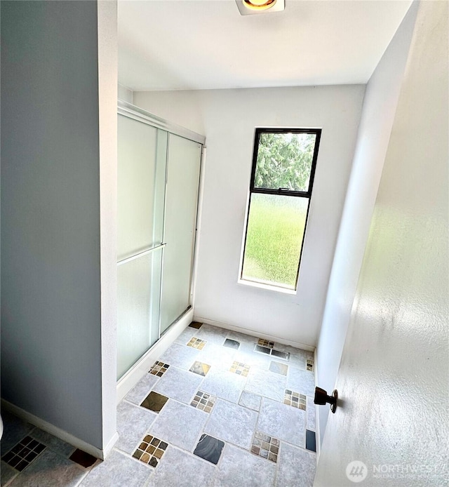 332 162nd Pl SE, Bothell, WA 98012 - bathroom featuring a shower stall, baseboards, and tile patterned flooring