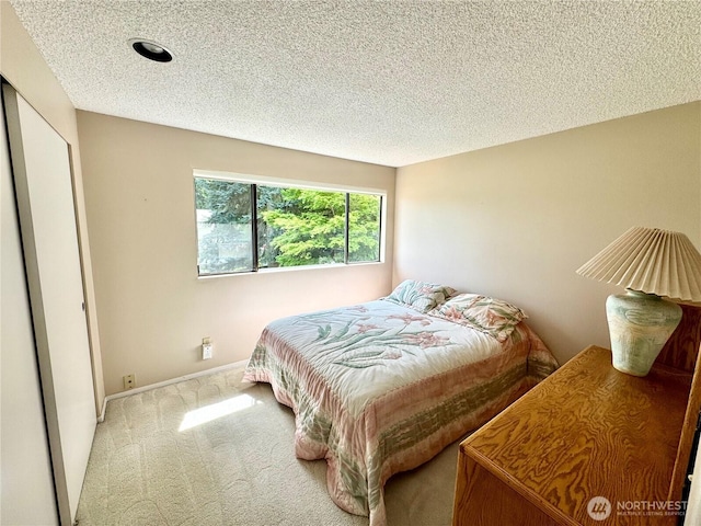 332 162nd Pl SE, Bothell, WA 98012 - bedroom featuring carpet flooring, baseboards, and a textured ceiling